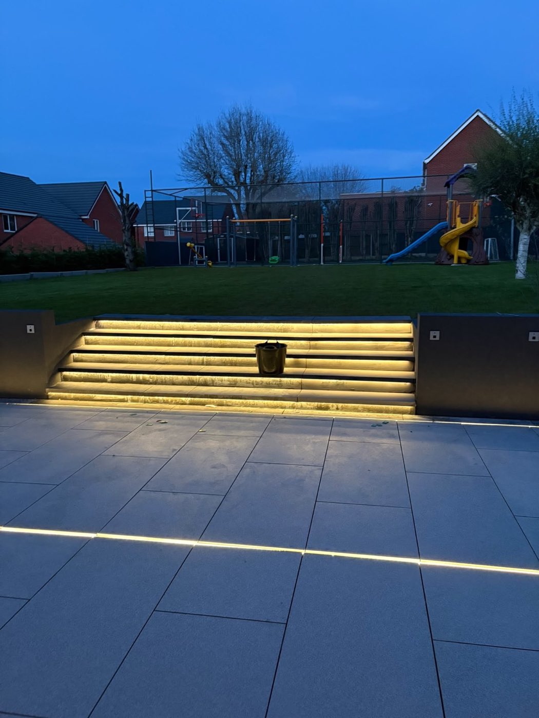 Patio with inset lighting — At dusk